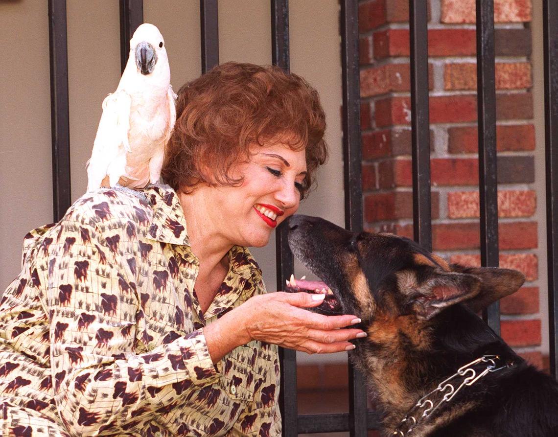 Martha Flores in 1996 with some of her pets.