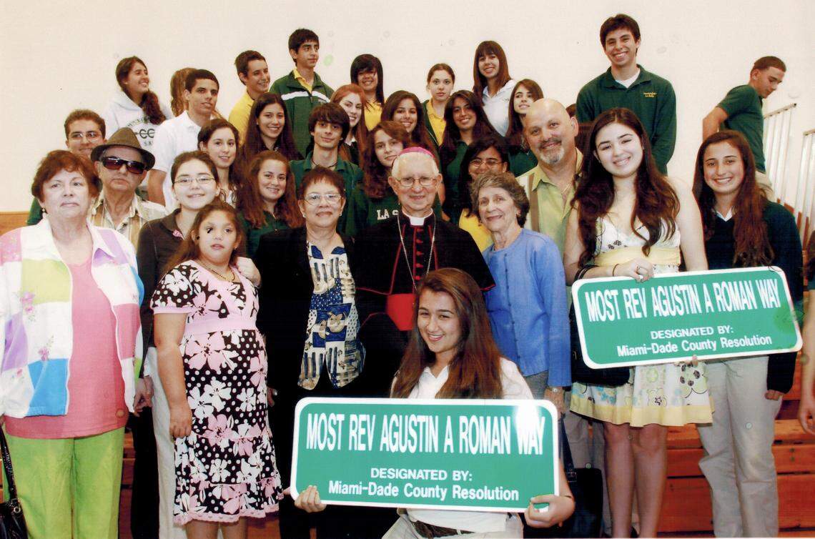 Iraida Román Martínez, to the right of Monsignor Agustín Román, with family and community members during the ceremony naming ‘Most Rev. Agustín A. Román Way’ in Miami-Dade County, a tribute to the beloved Cuban bishop of the exile community.