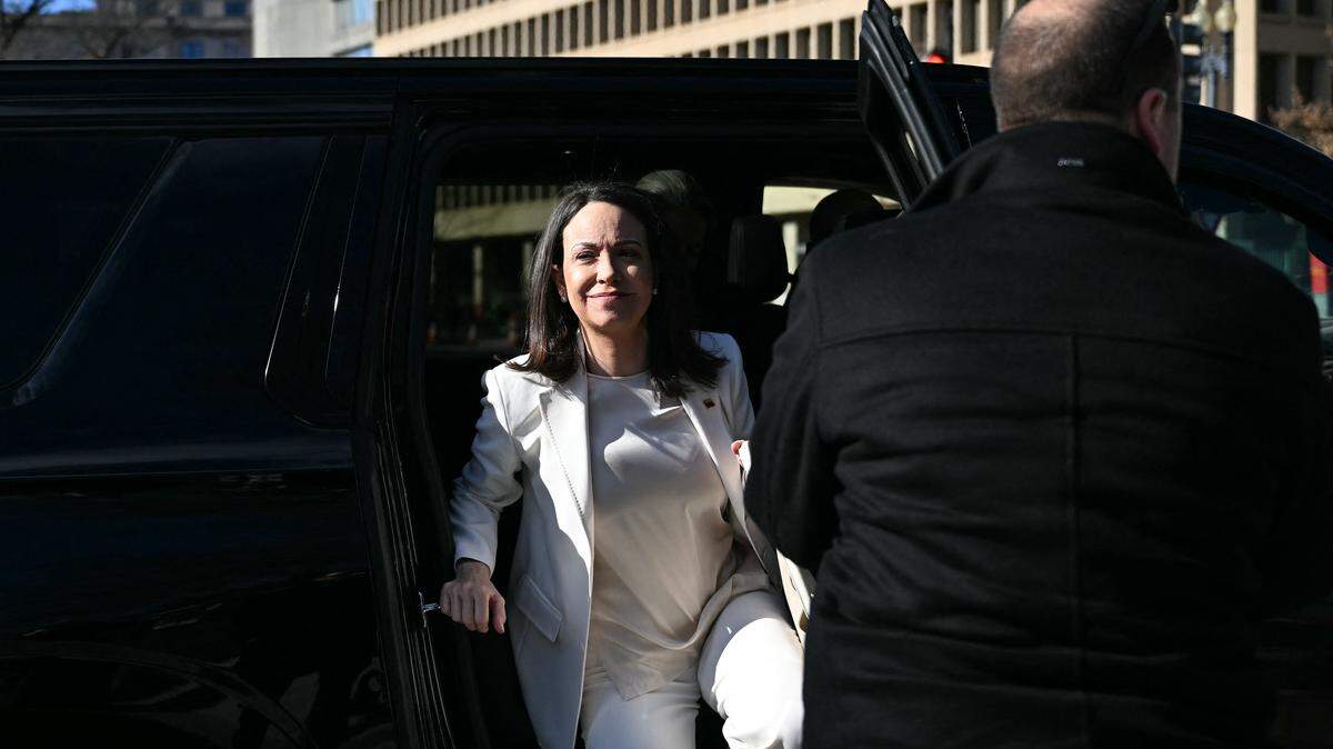 Venezuelan opposition leader Maria Corina Machado exits a vehicle as she arrives near the White House ahead of a meeting with US President Donald Trump, in Washington, DC on January 15, 2026. (Photo by Brendan SMIALOWSKI / AFP via Getty Images)