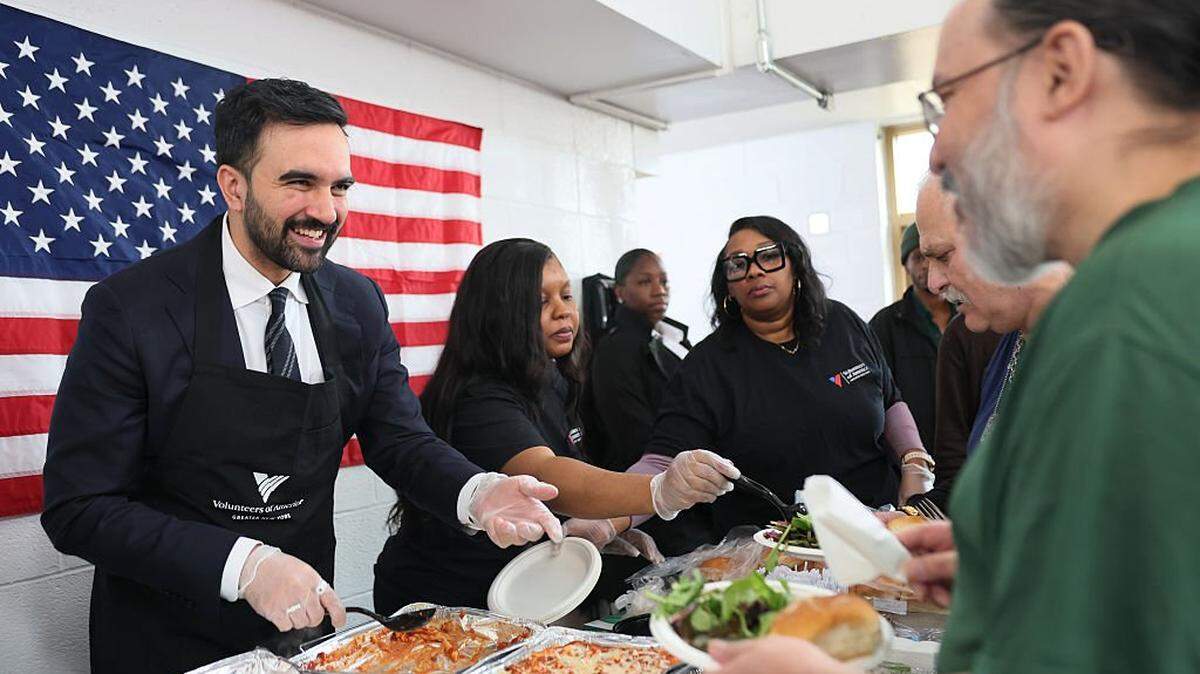 NEW YORK, NEW YORK - NOVEMBER 11: New York Mayor-Elect Zohran Mamdani serves meals during a Veteran's Day event at Volunteers of America - Commonwealth Veterans' Residence on November 11, 2025 in the Soundview neighborhood of the Bronx borough in New York City. Mamdani observed Veteran's day by serving meals, speaking with and listening to the concerns of veterans and speaking about the work his upcoming administration will be doing to help. (Photo by Michael M. Santiago/Getty Images)