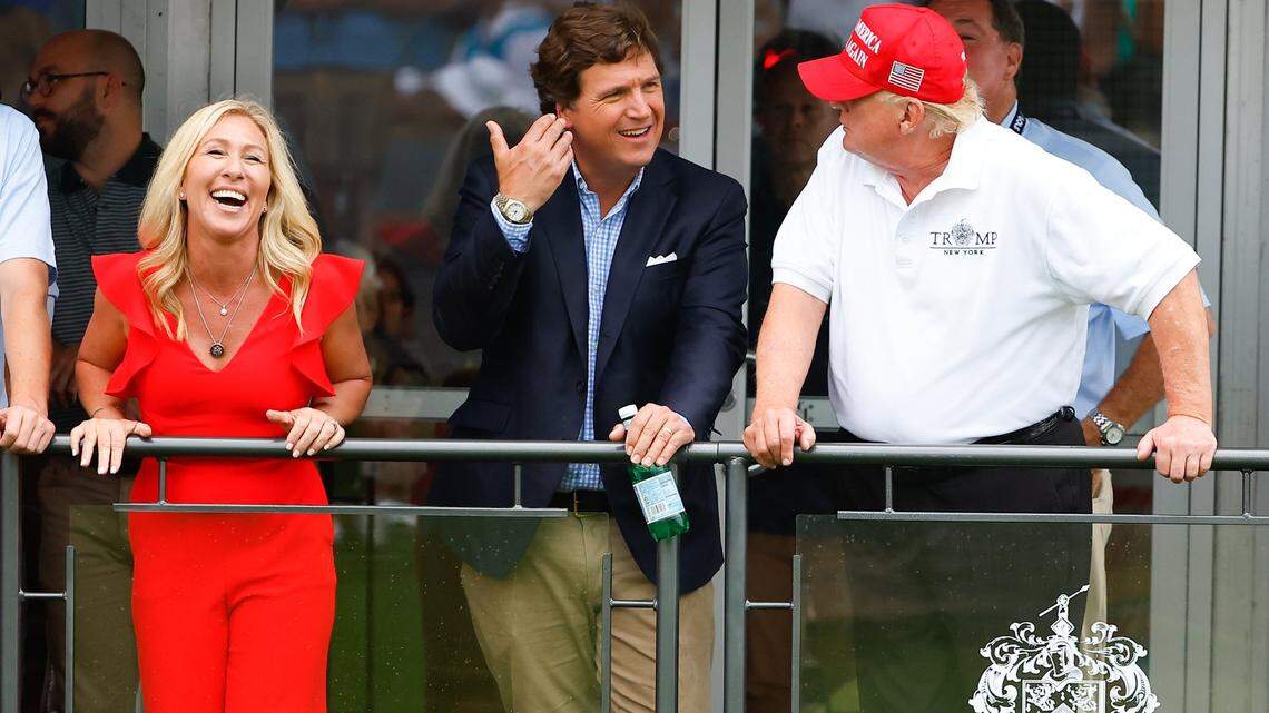 Tucker Carlson, center, with U.S. Rep. Marjorie Taylor Greene and former President Trump in 2022, during the LIV Golf Invitational Series Bedminster at Trump National Golf Club in New Jersey.