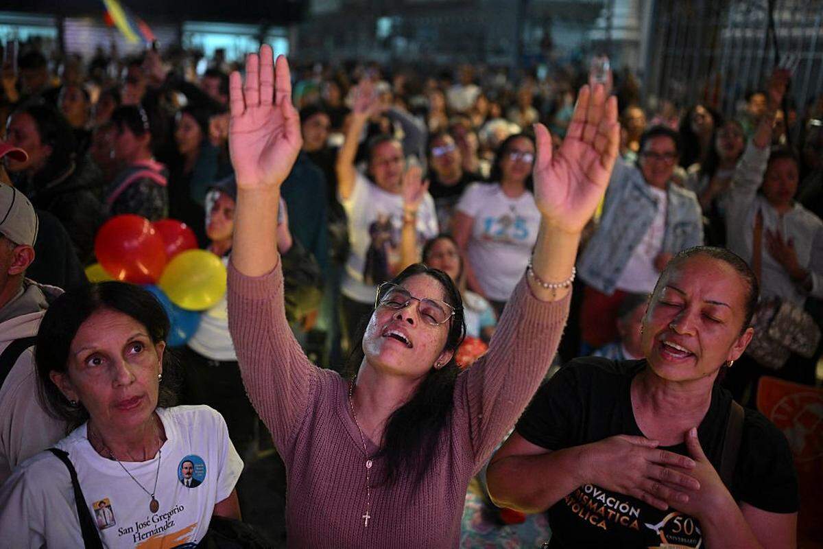 Catholic faithfuls gather at La Candelaria Square to attend the canonization ceremony of Venezuelan doctor Jose Gregorio Hernandez and Venezuelan Sister Maria Rendiles in Caracas on October 19, 2025. (Photo by Federico PARRA / AFP) (Photo by FEDERICO PARRA/AFP via Getty Images)