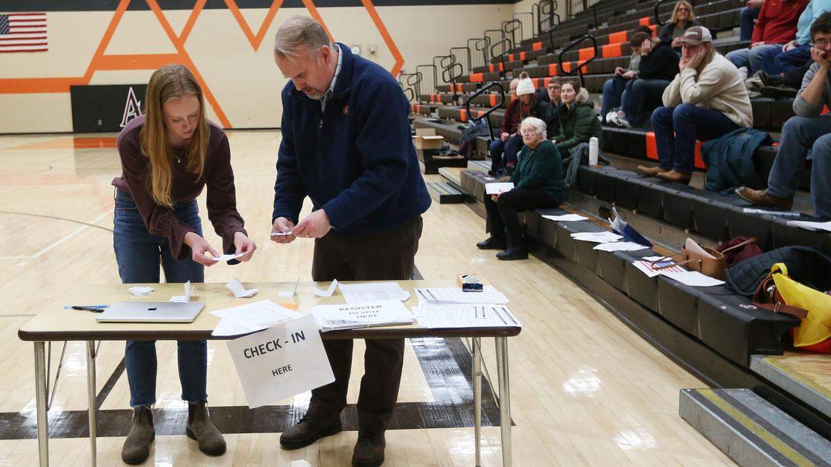Megan Decker, precinct-14 caucus secretary, and Chad Schneider, precinct-14 caucus chairman, count votes during the Iowa Caucus at Ames Middle School on Monday, Jan. 15, 2024, in Ames, Iowa. (Nirmalendu Majumdar/Ames Tribune-USA Today Network)