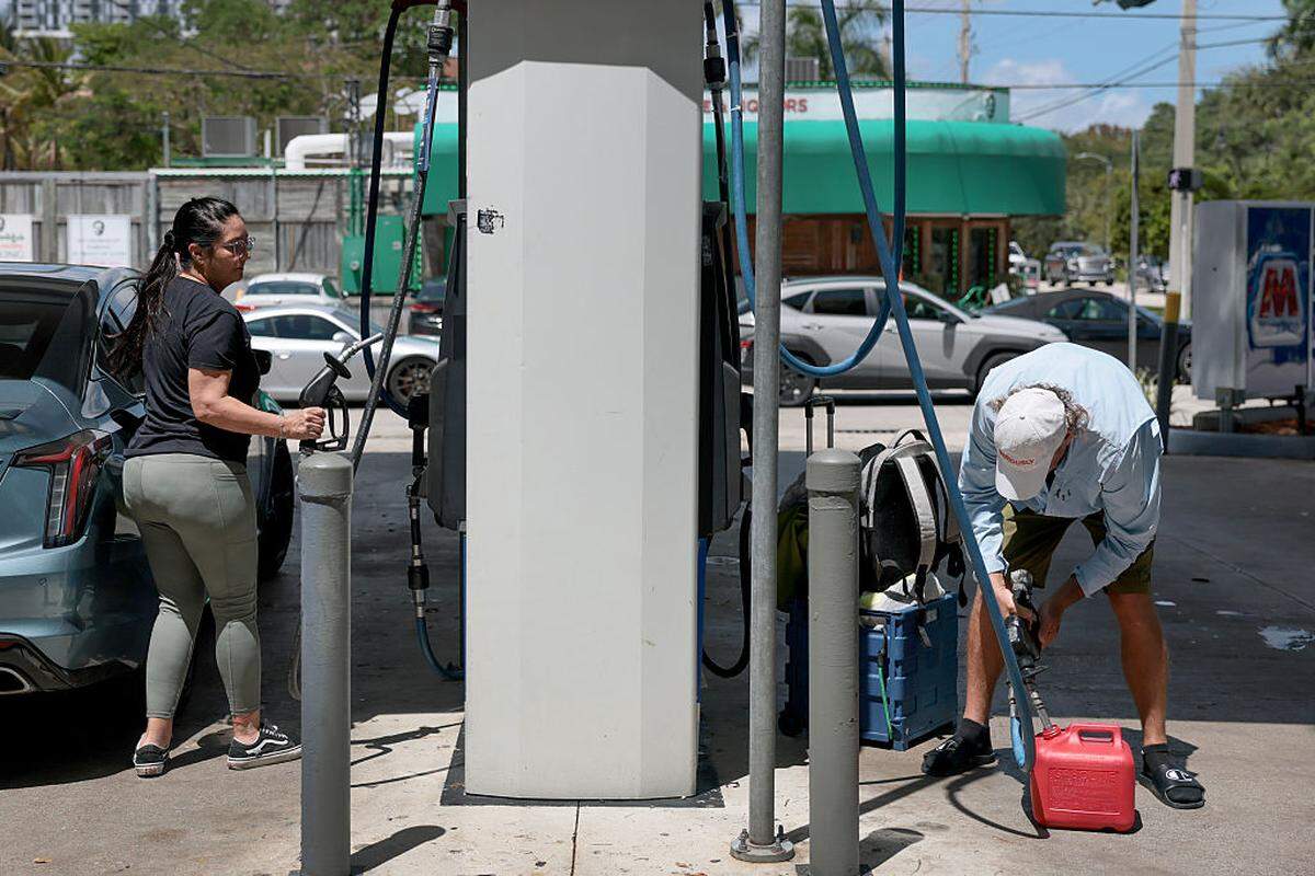 Drivers fill up on gas.