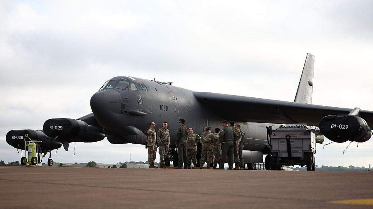 Flight crew from US Air Force 501st Combat Support Wing and 307th Bomb Wing are seen with a B-52 Stratofortress bomber aircraft at RAF Fairford on September 19, 2025, during a media event as part of the biannual multinational air combat training Exercise Cobra Warrior. (Photo by HENRY NICHOLLS / AFP) (Photo by HENRY NICHOLLS/AFP via Getty Images)