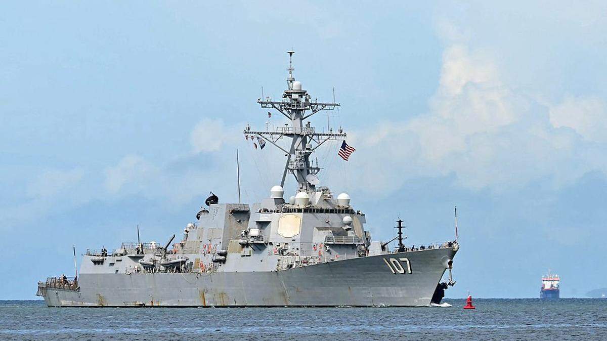 The USS Gravely warship is seen at a distance off the coast of Port of Spain on October 26, 2025. The US warship will visit Trinidad and Tobago for joint exercises near the coast of Venezuela amid Washington's campaign against alleged drug traffickers in the region. (Photo by MARTIN BERNETTI / AFP) (Photo by MARTIN BERNETTI/AFP via Getty Images)