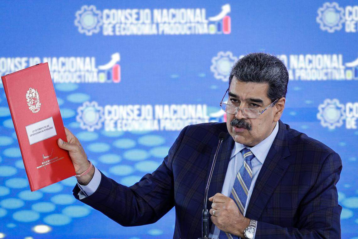 21 September 2023, Venezuela, La Guaira: Nicolas Maduro, president of Venezuela, shows a folder containing a proposed law to promote non-oil exports at a press conference at the Humboldt Hotel in Waraira Repano National Park. Photo: Jesus Vargas/dpa/Sipa USA