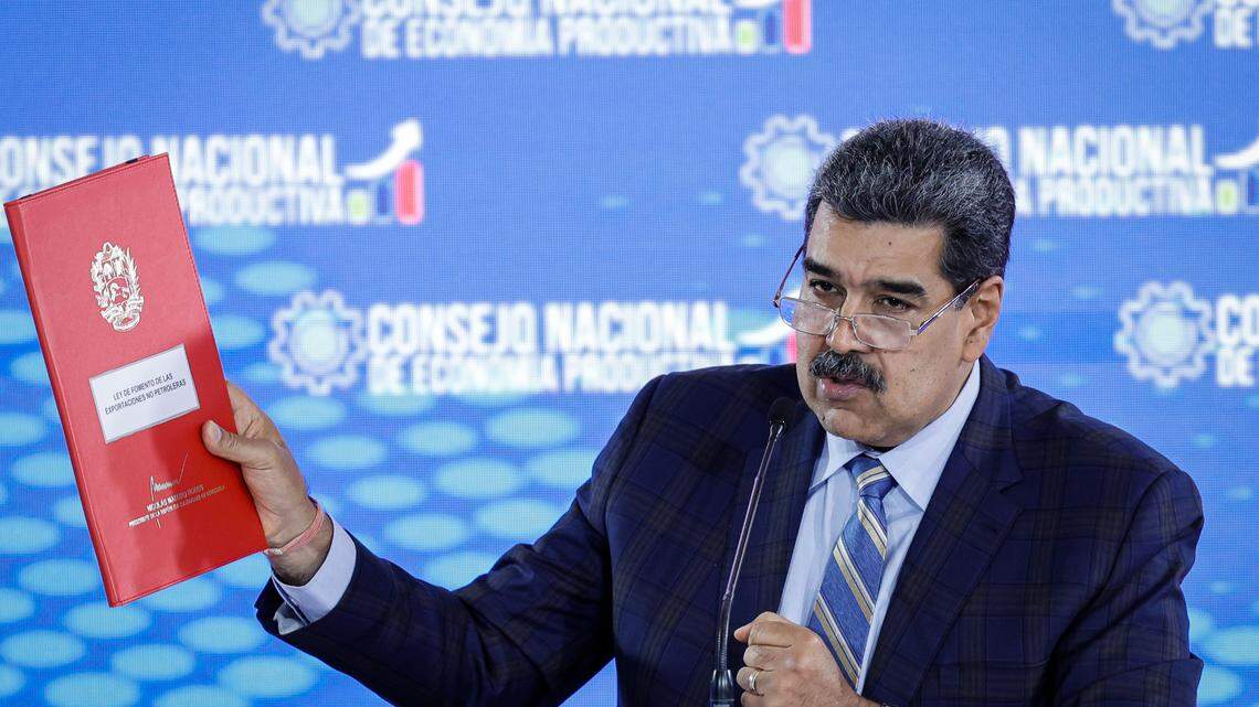 21 September 2023, Venezuela, La Guaira: Nicolas Maduro, president of Venezuela, shows a folder containing a proposed law to promote non-oil exports at a press conference at the Humboldt Hotel in Waraira Repano National Park. Photo: Jesus Vargas/dpa/Sipa USA