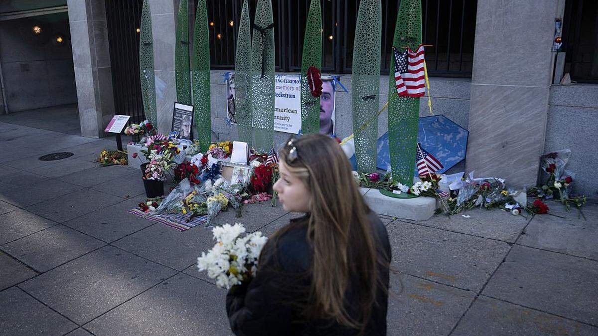 A makeshift memorial is seen at the location of last week's shooting of two members of the National Guard December 1, 2025, in Washington, DC. Two National Guard troops, Staff Sgt. Andrew Wolfe and Specialist Sarah Beckstrom, were shot on November 26 near the White House in what authorities described as a targeted attack by an Afghan migrant who had previously worked with the US military in Afghanistan, a case now being treated as a terrorism investigation. (Photo by Brendan Smialowski / AFP via Getty Images)