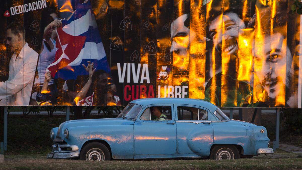 A taxi cruises in Havana.