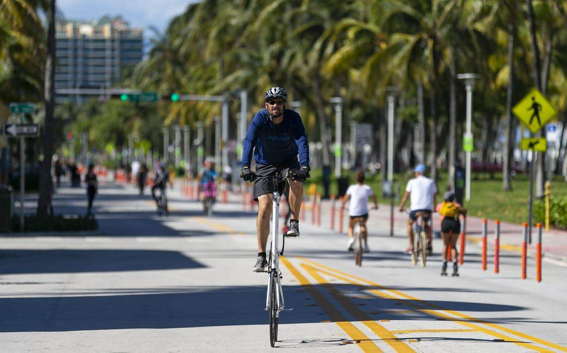 Kanen Moffett, 38, a Coral Gables resident, rides his bike down Ocean Drive in Miami Beach. It’s the only street in greater Miami that’s been closed to cars during the coronavirus pandemic.