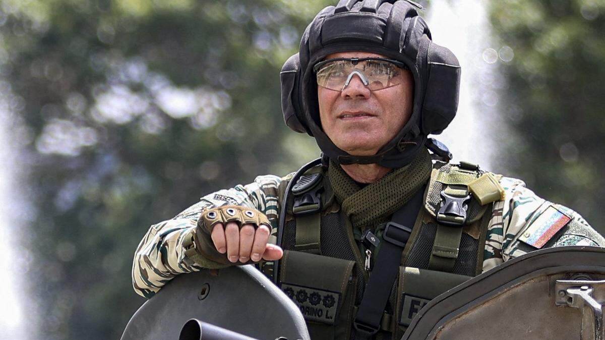 Venezuela's Defense Minister Vladimir Padrino Lopez stands on a Venezuelan army tank after a military exercise, at a highway in Caracas on September 20, 2025. US President Donald Trump threatened Venezuela with "incalculable" consequences if it refuses to take back migrants it has "forced into the United States," as tensions soar with Caracas after Venezuela accused the United States of waging an "undeclared war" in the Caribbean and called for a UN probe of American strikes that have killed over a dozen alleged drug traffickers on boats in recent weeks. (Photo by Pedro MATTEY / AFP) (Photo by PEDRO MATTEY/AFP via Getty Images)