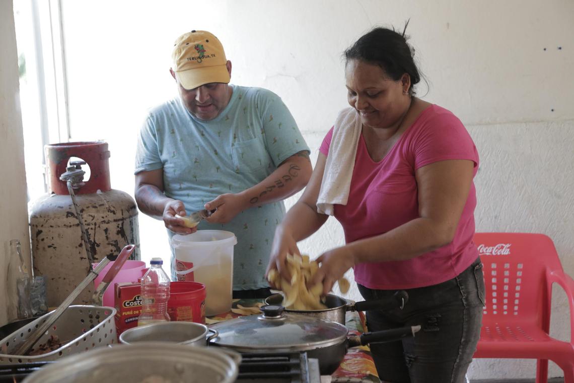 Matamoros, Mexico, July 30, 2019- Rene Saborido y Mariela Cervantes trabajan en la cocina de Gorditas Tía Raquel Restaurante en Matamoros, Mexico.
