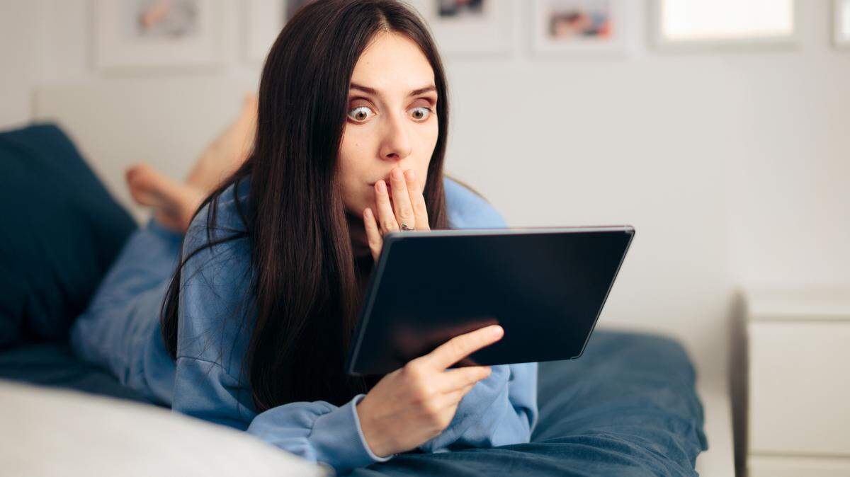Shocked person reading conspiracy theories and fake news