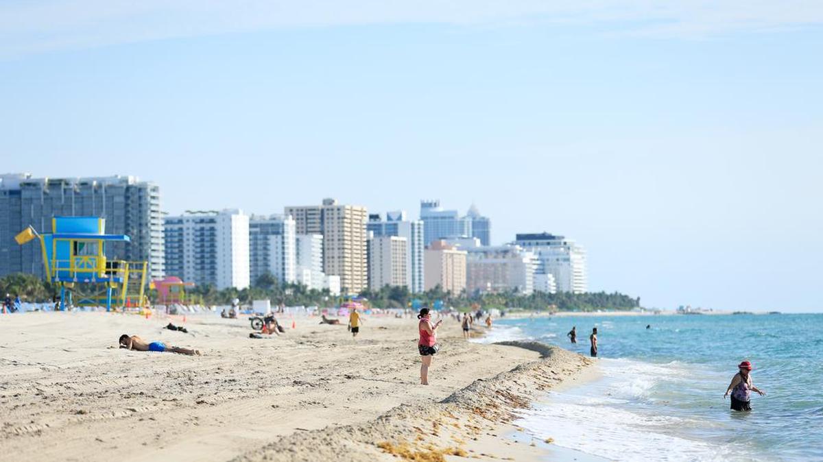 The Miami Association of Realtors, Friends of the Underline and NAIOP will host real estate-related webinars this week. Above: Beach goers on South Beach in early July, 2020.