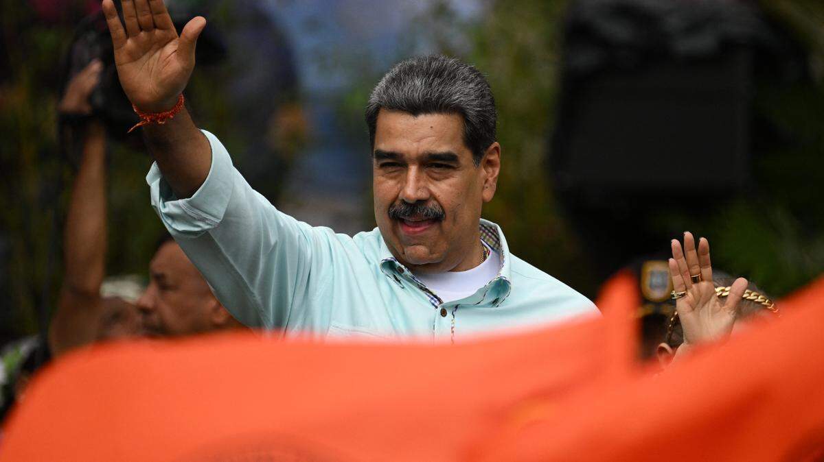 TOPSHOT - Venezuela's President Nicolas Maduro gestures during a rally to mark the anniversary of the Battle of Santa Ines, in Caracas on December 10, 2025. (Photo by Federico PARRA / AFP via Getty Images)