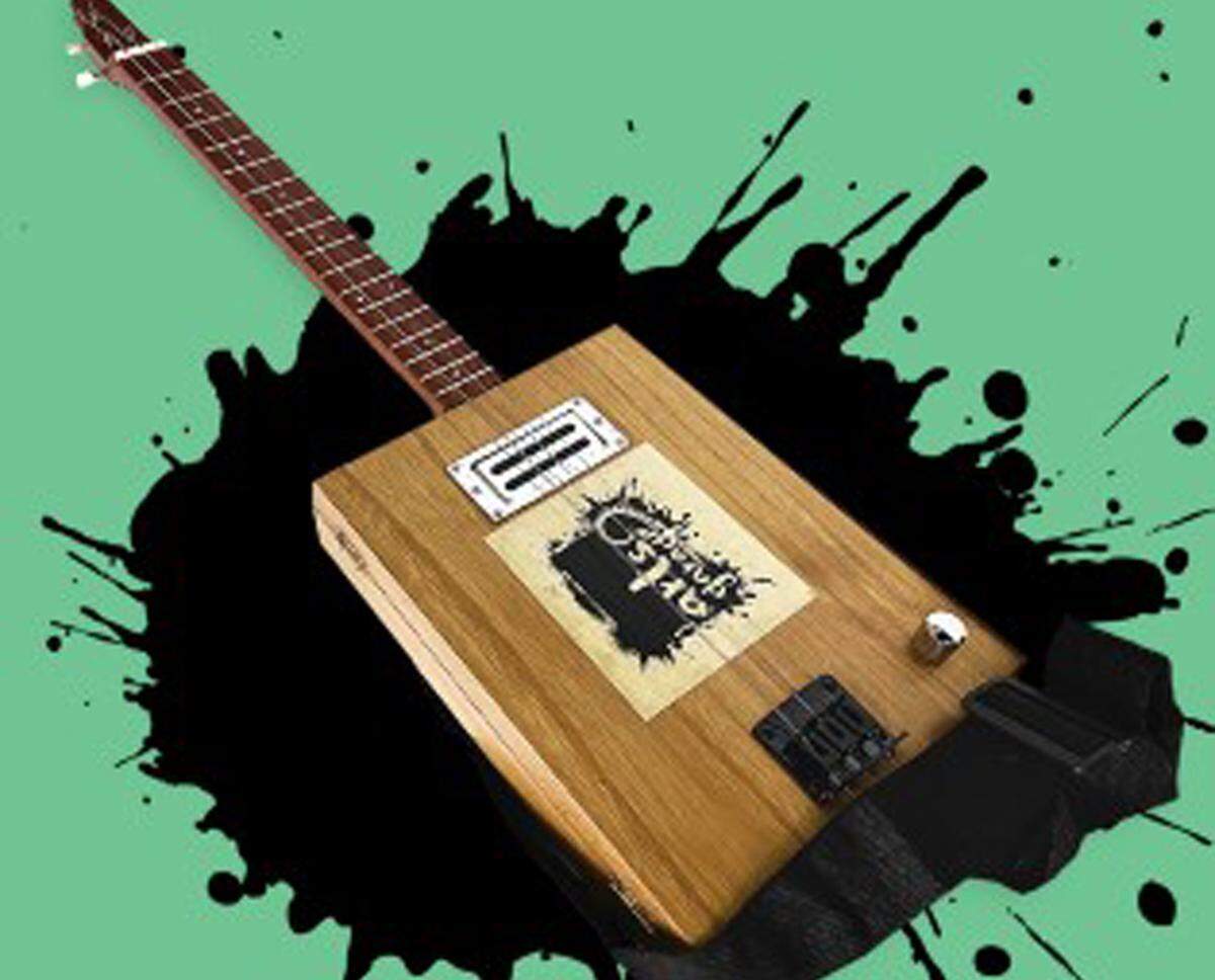 Arts Garage tiene el honor de rifar una guitarra Cigar Box&nbsp;personalizada por el difunto Bruce Gootner.