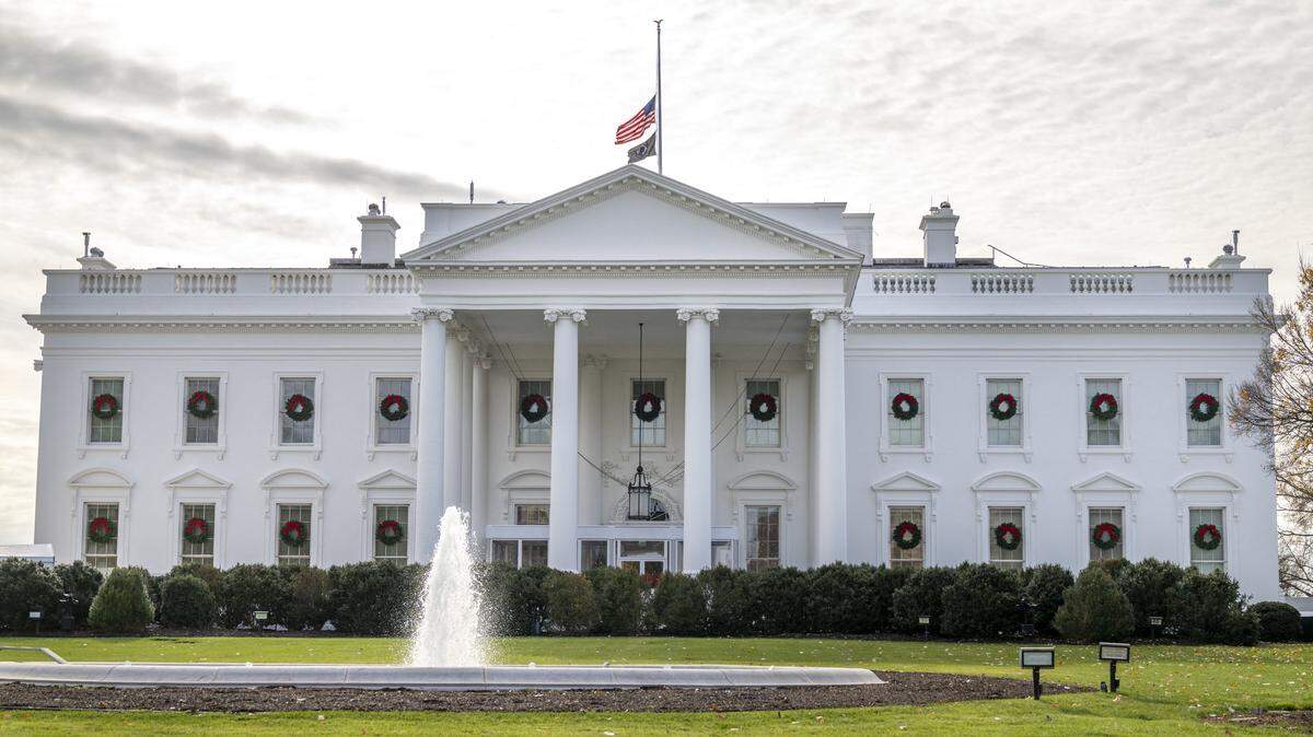 The US National flag is lowered to half mast at the White House in Washington, DC on December 4, 2025, in honor of Sarah Beckstrom, the National Guard member who was fatally shot the week before. An Afghan man accused of shooting two members of the National Guard near the White House, killing one, pleaded not guilty on December 2, 2025 to murder charges. Lakanwal is charged with first-degree murder for the death of Sarah Beckstrom, 20, a National Guard member from West Virginia, as well as assault with intent to kill and firearms offenses. (Photo by DANIEL HEUER / AFP via Getty Images)