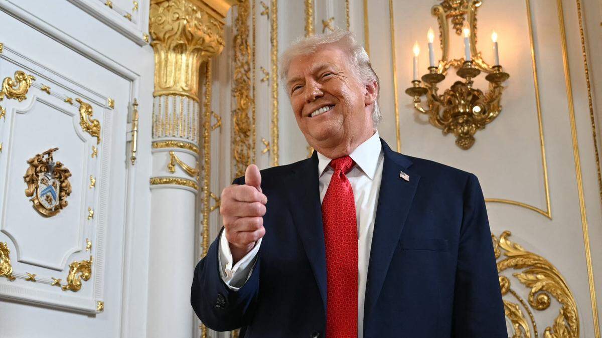 US President Donald Trump gives a thumbs up as he arrives at a dedication ceremony for Southern Boulevard, in the ballroom at Mar-a-Lago in Palm Beach, Florida, on January 16, 2026. (Photo by ANDREW CABALLERO-REYNOLDS / AFP via Getty Images)