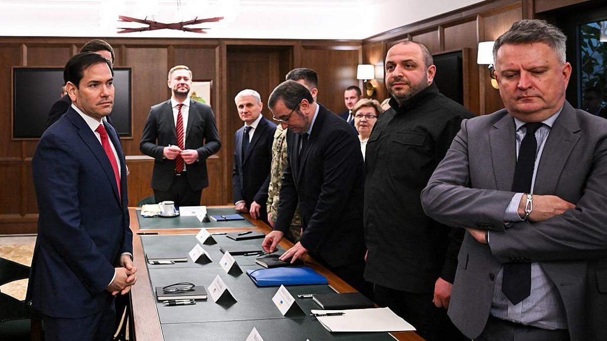 US Secretary of State Marco Rubio (L) and Secretary of the National Security and Defense Council of Ukraine and head of the Ukrainian delegation Rustem Umerov (2R), alongside Ukrainian First Deputy Foreign Minister Sergiy Kyslytsya (R), prepare to take their seats during a meeting in Hallandale Beach, Florida on November 30, 2025. (Photo by CHANDAN KHANNA / AFP via Getty Images)