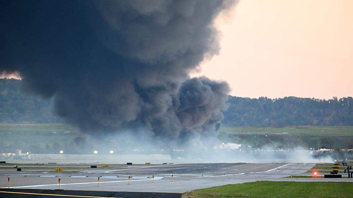 LOUISVILLE, KENTUCKY - NOVEMBER 04: Fire and smoke mark where a UPS cargo plane crashed near Louisville Muhammad Ali International Airport on November 04, 2025 in Louisville, Kentucky. The fully fueled plane crashed shortly after takeoff with a shelter-in-place order issued for within 5 miles of the airport. (Photo by Stephen Cohen/Getty Images)