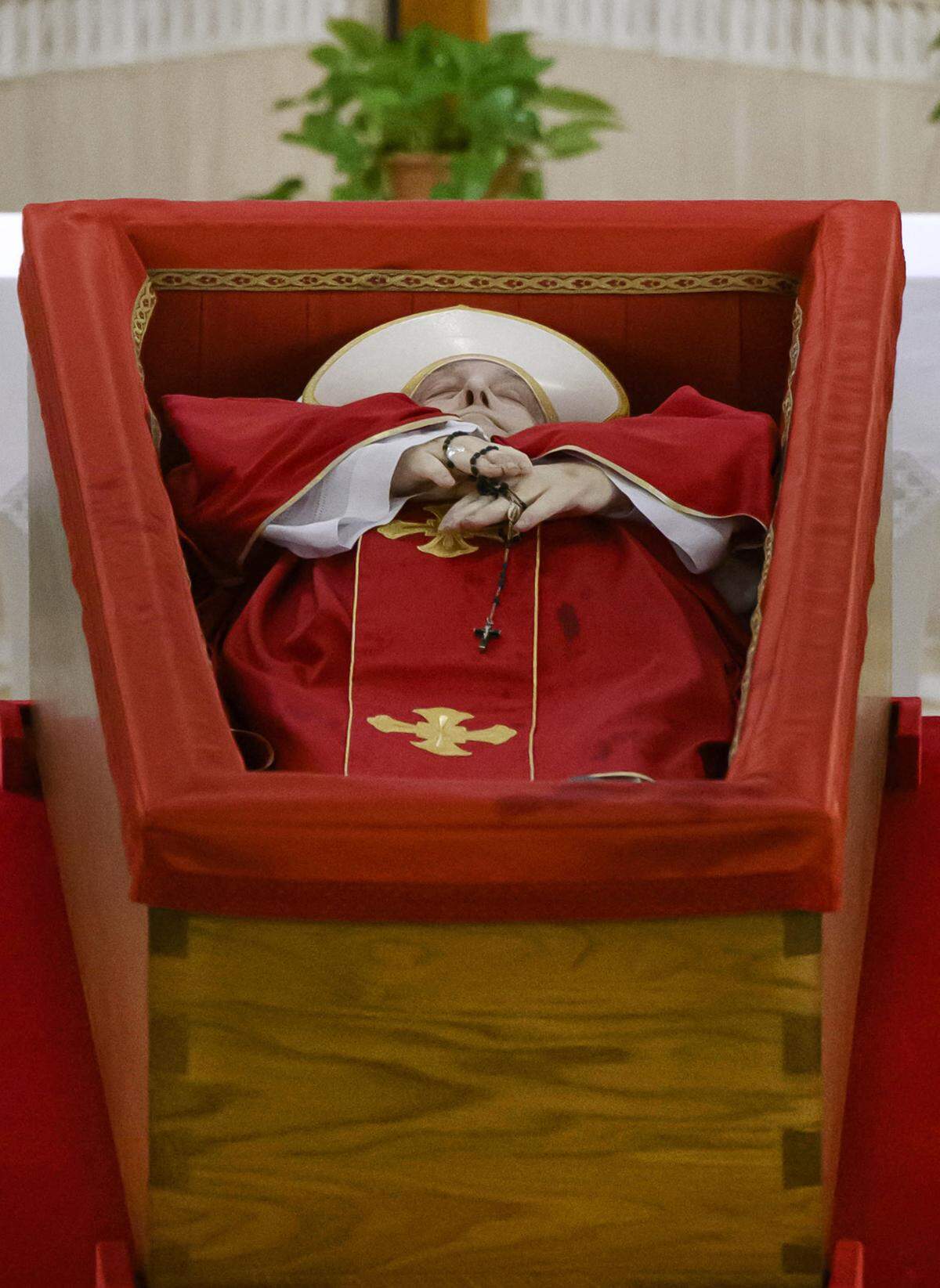 The rite confirming the death and the placement of Pope Franciss body in the coffin took place on the evening of Monday 21 April 2025 in the ground-floor chapel of the Casa Santa Marta where the pope lived at the Vatican. The official declaration of death was read aloud. The act was validated by Cardinal Kevin Farrell, Camerlengo of the Holy Roman Church. The ceremony lasted just under an hour. Photo by (EV) Vatican Media/ Abaca/Sipa USA