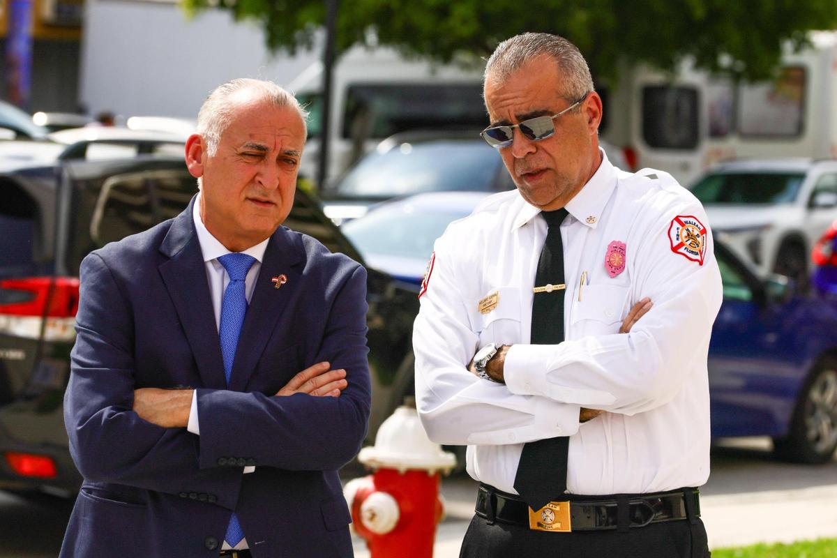 Hialeah Mayor Esteban “Steve” Bovo and Hialeah Fire Chief Willians Guerra speak outside Fire Station 1 at 83 E. Fifth St. in Hialeah on Oct. 29, 2024, just days before Guerra’s resignation amid a scandal involving cheating allegations on a test for the highest ranks in the Hialeah Fire Department.