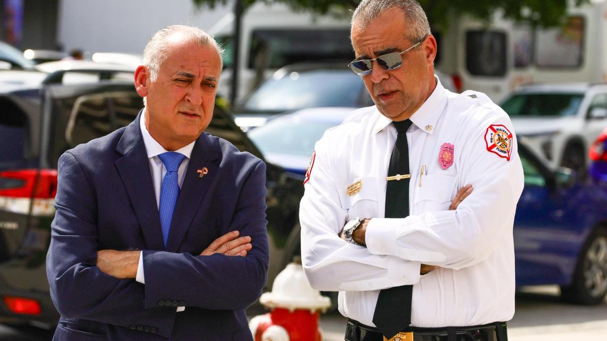 Hialeah Mayor Esteban Bovo Jr. and Fire Chief Willians Guerra speak outside Fire Station 1, located at 83 E. Fifth St., Hialeah, Florida, on Tuesday, October 29, 2024. Guerra resigned two days after the Miami Herald published a story detailing allegations of cheating in the department for a battalion chief position—an issue Guerra did not address.