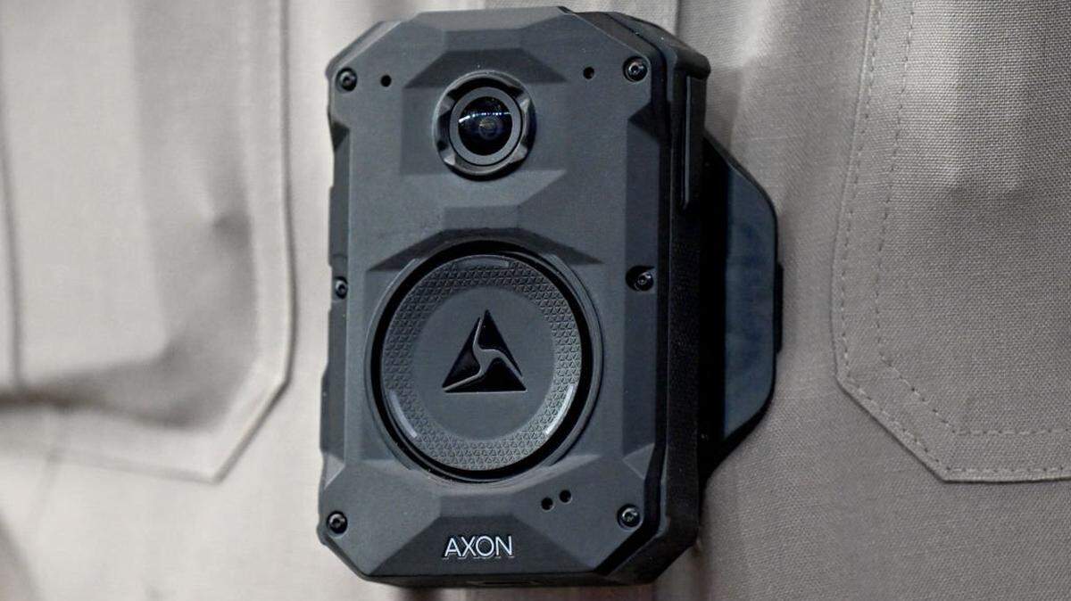 An Arizona State Trooper law enforcement officer wears an AXON body camera during a sporting event in Glendale, Arizona, on February 23, 2025. (Photo by Patrick T. Fallon / AFP) (Photo by PATRICK T. FALLON/AFP via Getty Images)