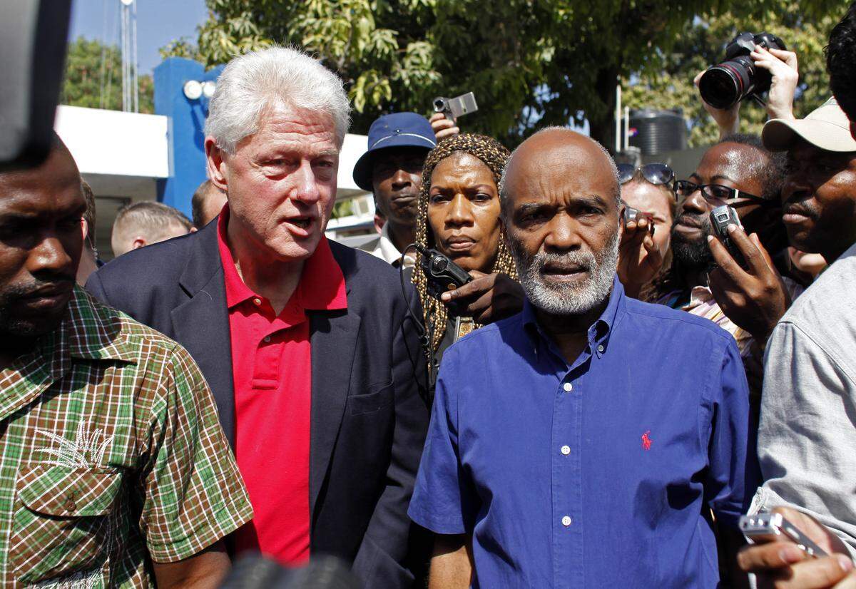 U.N. special envoy for Haiti and former president Bill Clinton speaks with Haiti’s President René Préval, right, after his arrival in Port-au-Prince, on Feb. 5, 2010. Clinton expanded his U.N. role as head of relief and reconstruction efforts.