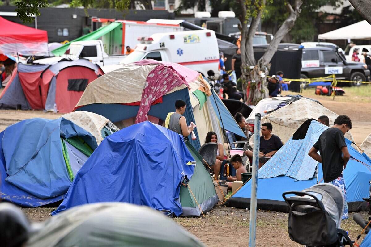 People displaced following the June 24 twin earthquakes stay at an improvised camp in a golf club in Caraballeda, La Guaira State, Venezuela on July 3, 2026, . The death toll from Venezuela's devastating twin earthquakes has risen to 2,645, with more than 12,600 injured and thousands mores reported still missing, according to new official figures. (Photo by MARTIN BERNETTI / AFP via Getty Images)
