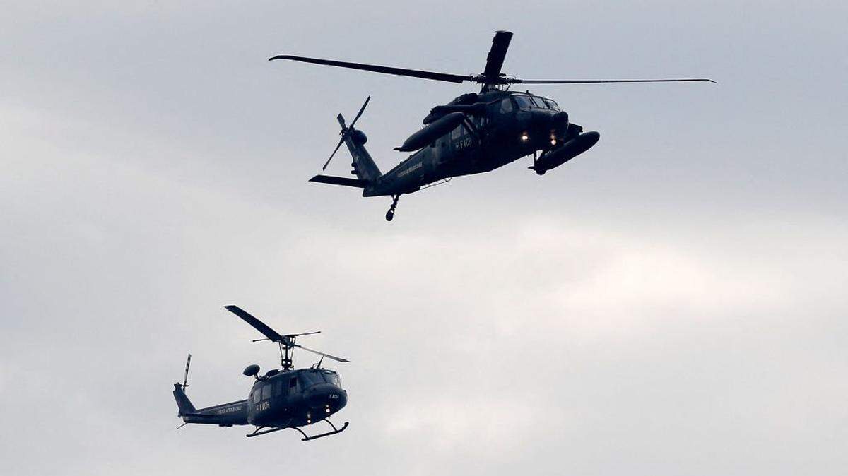 Air Force Black Hawk MH-60M helicopters take part in the annual military parade in commemoration for the Day of the Glories of the Army, a tradition within the Independence Day holidays, at the O'Higgins Park in Santiago, on September 19, 2023. (Photo by Javier TORRES / AFP) (Photo by JAVIER TORRES/AFP via Getty Images)