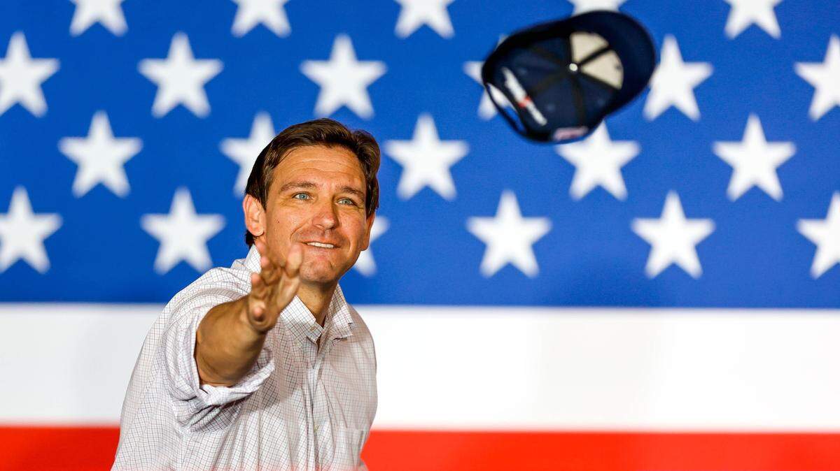 Florida Gov. Ron DeSantis tosses ball caps to the crowd atan event by the Never Back Down super PAC in Tulsa, Oklahoma, on June 10, 2023.