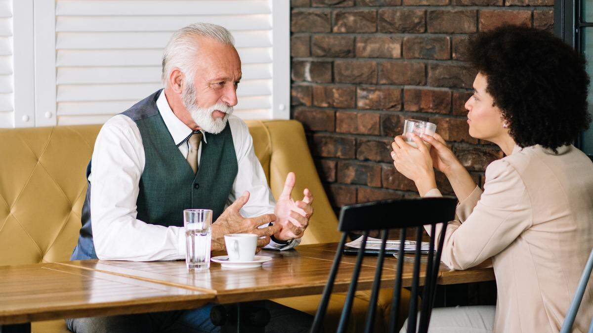 Business colleagues having coffee together