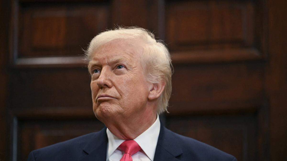 US President Donald Trump looks on during an announcement of a $6.25 billion donation from Michael Dell, CEO of Dell Technologies and his wife Susan to "Trump Accounts," in the Roosevelt Room of the White House in Washington, DC on December 2, 2025. The donation will be intended to fund investment accounts for at least 25 million American children. (Photo by ANDREW CABALLERO-REYNOLDS / AFP via Getty Images)