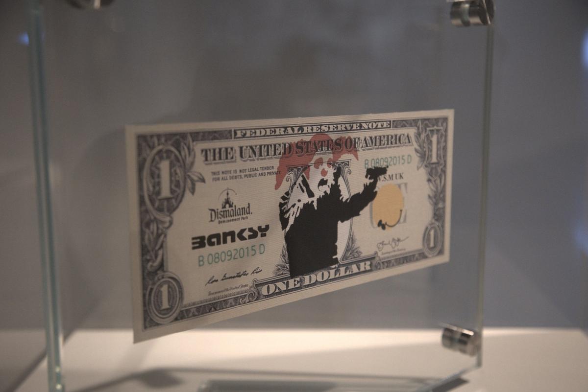 Miami, February 25, 2022 - A work titled ‘Dismaland Bank Note, Clown with guns, 2015’ at The Art of Banksy: “Without Limits” at the Ice Palace Studios, 1400 N Miami Ave, Miami, FL, 33136