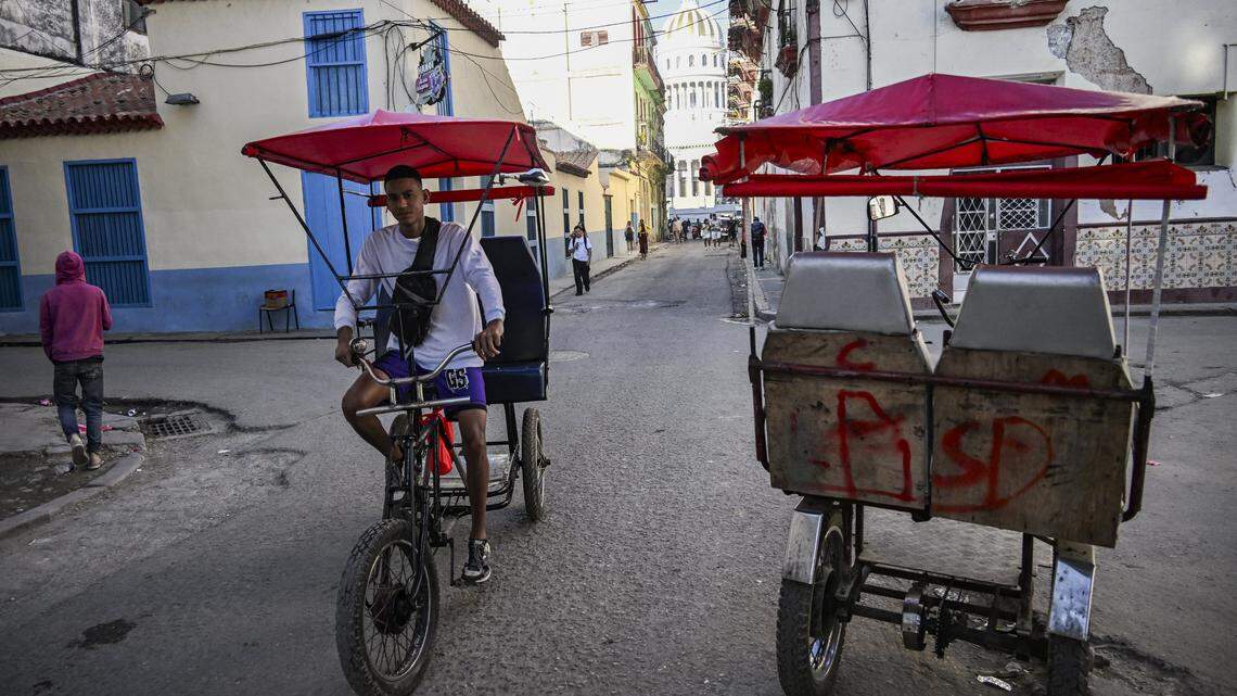 A pedicab rides along a street in Havana, Cuba on February 13, 2026. The fuel crisis in Cuba, and particularly in Havana, is forcing many workers who depend on daily mobility to abandon gasoline cars and turn to electric tricycles and bicycle taxis as more accessible alternatives. (Photo by YAMIL LAGE / AFP via Getty Images)