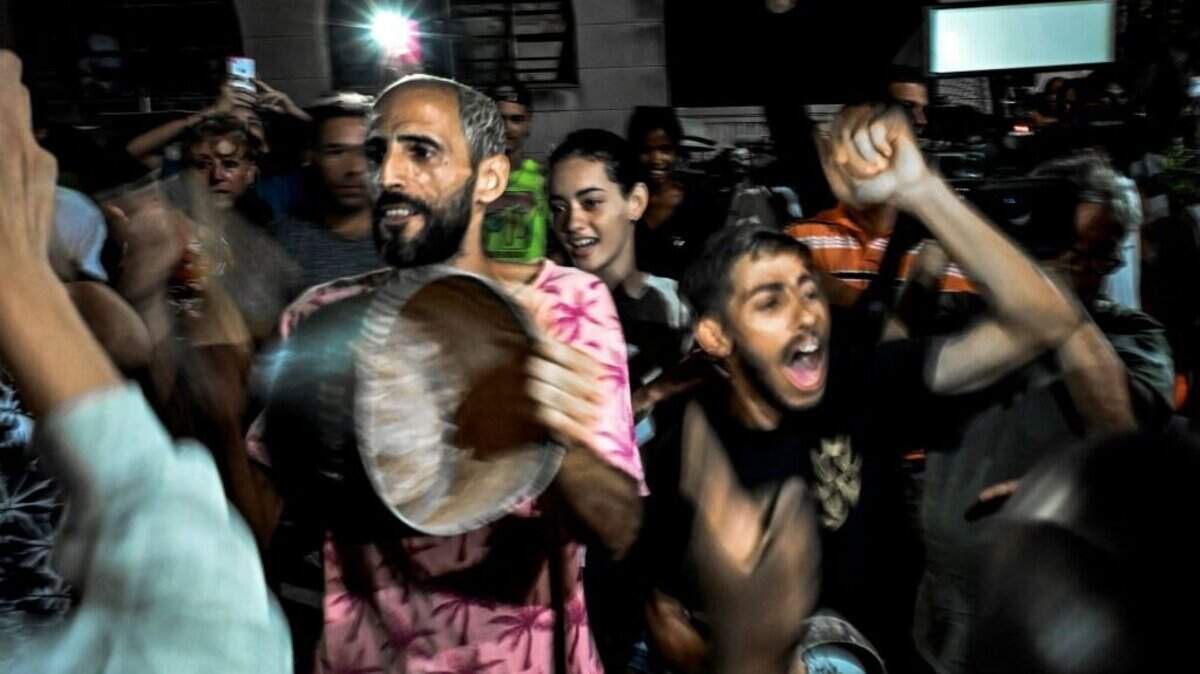 Cubans protest with pans against a five-day blackout due to the passage of Hurricane Ian, in a street in Havana, on October 1, 2022. - The National Electric System (SEN) collapsed on September 27, leaving the island blacked out due to the damage caused by the powerful hurricane Ian, which caused the death of three people and severe damage in the western part of the country. (Photo by YAMIL LAGE / AFP) (Photo by YAMIL LAGE/AFP via Getty Images)