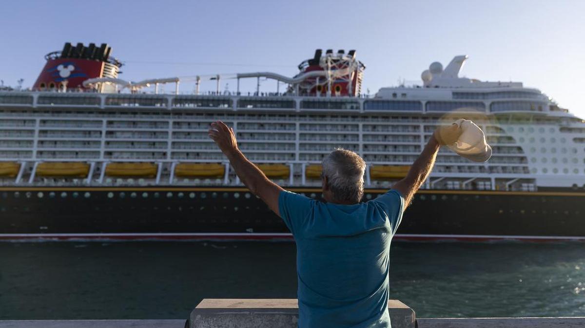 Giwrgos Telwnis, from Greece, waves as a Disney Cruise Line leaves PortMiami near South Pointe Park on Feb. 27, 2023, in Miami Beach. Forecasters expect some moisture to move over South Florida on the weekend of Sept. 8-9, 2023. But the thunderstorms would be concentrated in the afternoons and there will still be clear sailing skies.