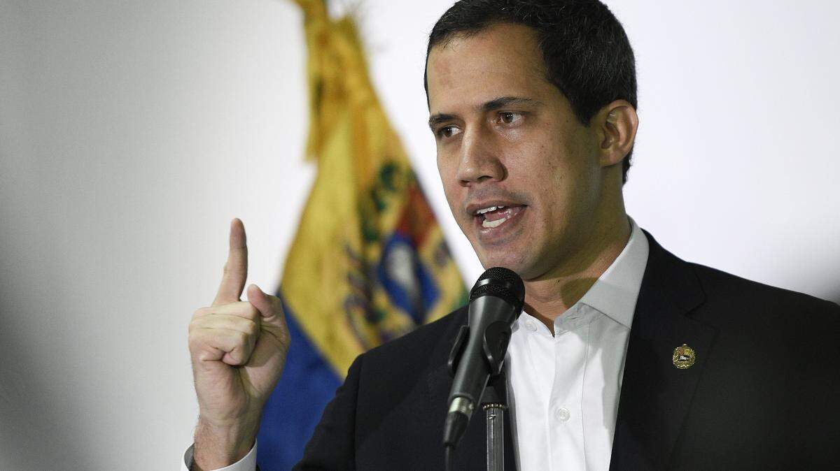 Venezuela’s opposition leader Juan Guaidó speaks to the press in Caracas, Venezuela, Sunday, Dec. 1, 2019.