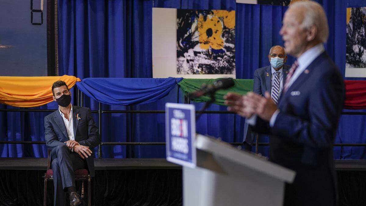 KISSIMMEE, FL - SEPTEMBER 15: Singer Ricky Martin (L) looks on as Democratic presidential nominee and former Vice President Joe Biden speaks at a Hispanic heritage event at Osceola Heritage Park on September 15, 2020 in Kissimmee, Florida. National Hispanic Heritage Month in the United States runs from September 15th to October 15th. (Photo by Drew Angerer/Getty Images)