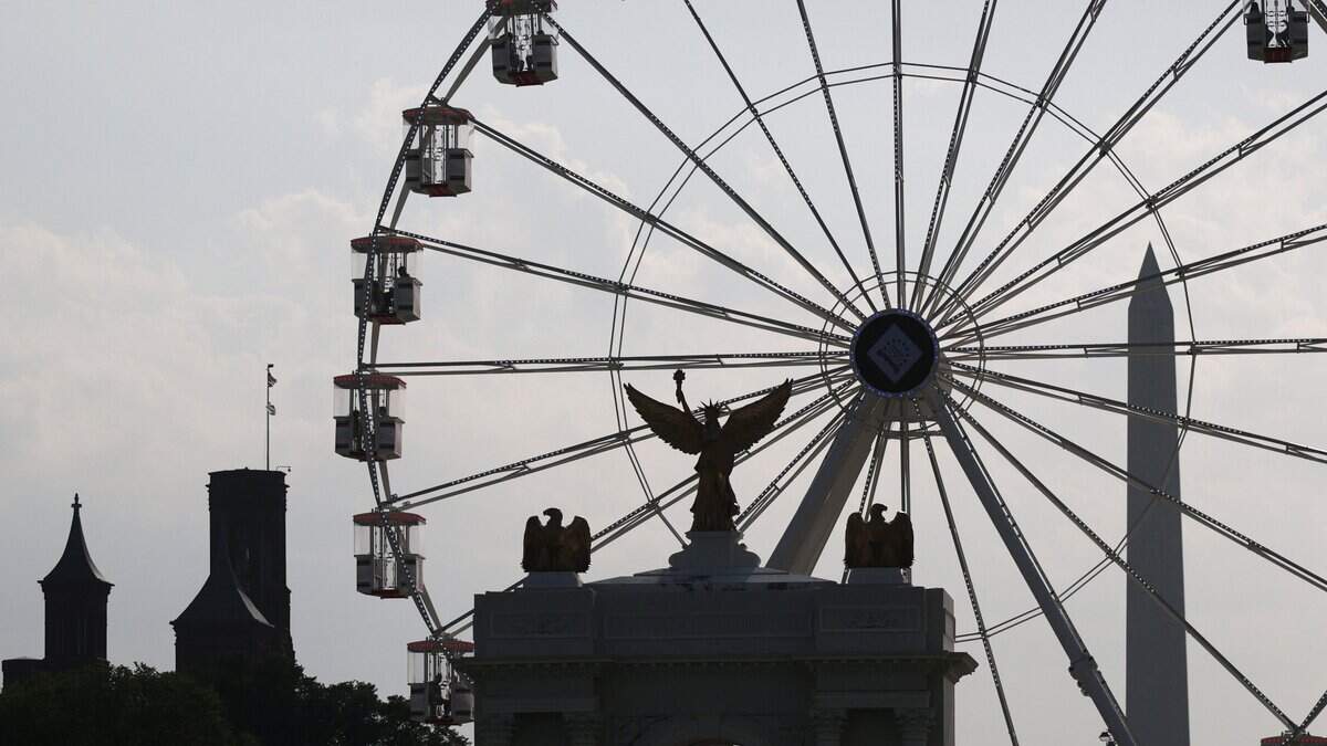 WASHINGTON, DC - JULY 01: A replica of President Trump's planned “triumphal arch,” the Freedom 250 Ferris wheel and the Washington Monument are seen during the "Great American State Fair" on the National Mall on July 1, 2026 in Washington, DC. The Freedom 250-backed Great American State Fair celebrating the 250th anniversary of the United States runs through July 10th. (Photo by Alex Wong/Getty Images)