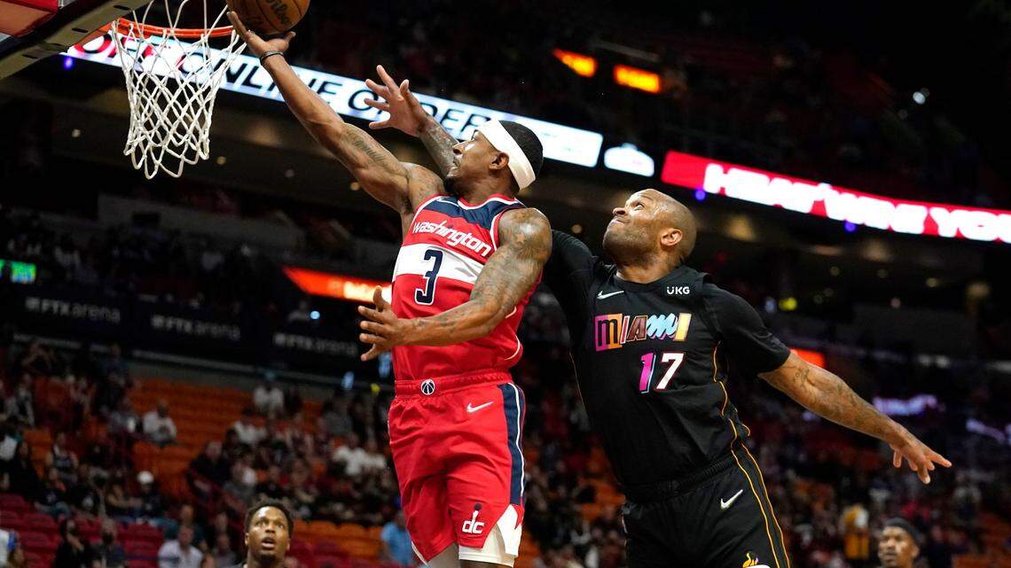Washington Wizards guard Bradley Beal (3) shoots over Miami Heat forward P.J. Tucker (17) during the first half of an NBA basketball game, Thursday, Nov. 18, 2021, in Miami. (AP Photo/Lynne Sladky)