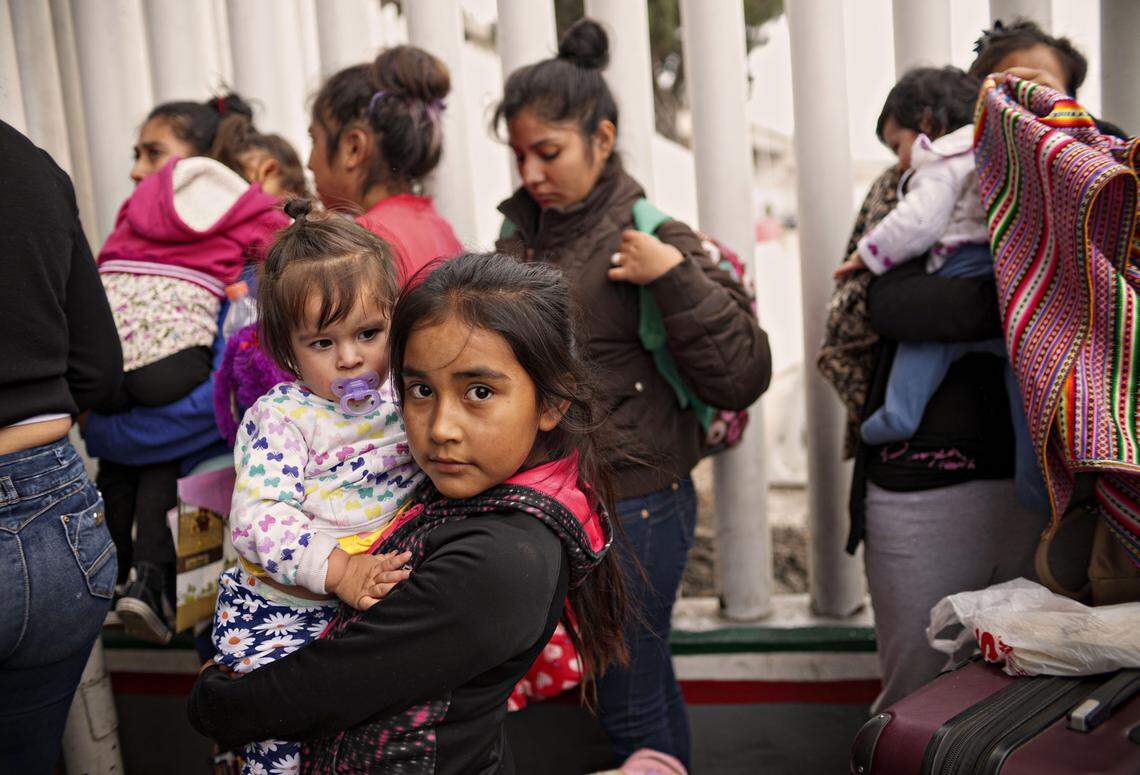 Undocumented immigrants wait to be interviewed about their asylum claims at the port of entry to the United States in Tijuana, Mexico in June 2018.