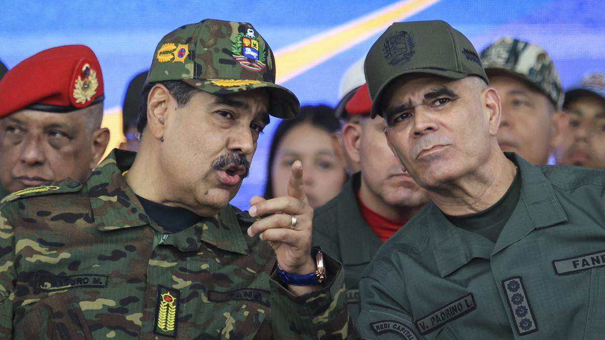 CARACAS, VENEZUELA - NOVEMBER 25: President of Venezuela NicolÃ(degrees)s Maduro talks with Minister of Defense Vladimir Padrino Lopez during a military ceremony commemorating the 200th anniversary of the presentation of the 'Sword of Peru' to Venezuelan independence hero SimÃ³n BolÃvar on November 25, 2025, in Caracas, Venezuela. The United States recently designated the "Cartel De Los Soles" (Cartel of The Suns) as a foreign terrorist organization, a group allegedly led by the president of Venezuela, Nicolas Maduro, and which, it is presumed, includes high-ranking members of the Venezuelan government. (Photo by Jesus Vargas/Getty Images)