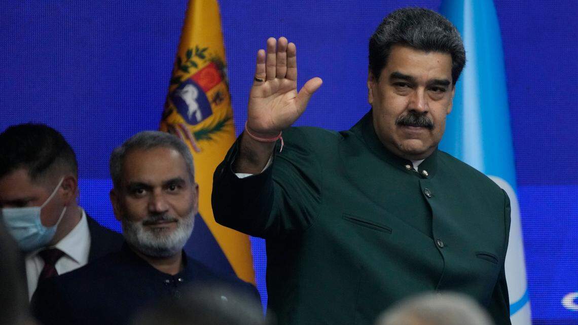 Venezuela’s ruler Nicolás Maduro gestures to guests as he arrives for an event with Organization of Petroleum Exporting Countries (OPEC) Secretary General Haitham al-Ghaisin (left) at the Miraflores Presidential Palace in Caracas, Venezuela, on Wednesday, September 14, 2022.