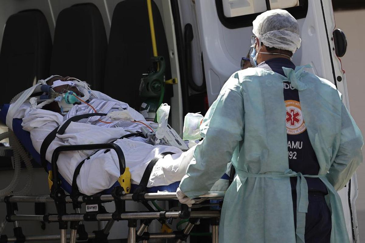 A patient suspected of having COVID-19 is received at the HRAN Hospital in Brasilia, Brazil, Wednesday, March 3, 2021. The number of new COVID-19 cases in Brazil is still surging, with a new record high of deaths reported on Tuesday.