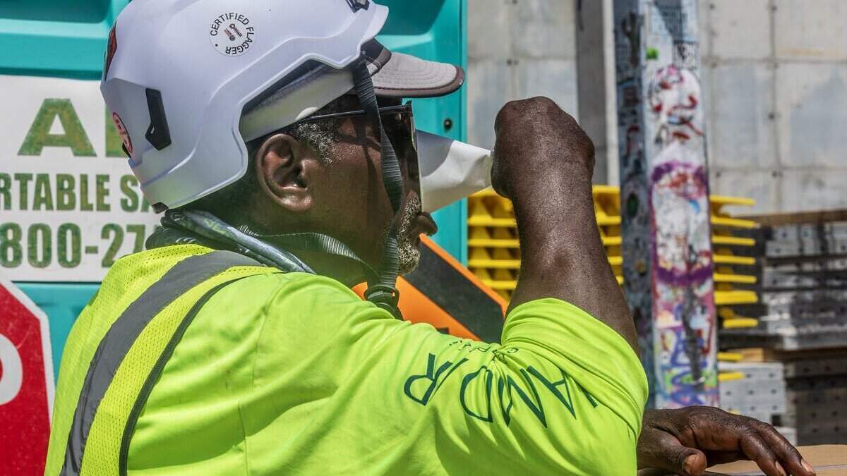 Construction worker Patrick Khon hydrates while working on Wynwood as a heat advisory is in effect for most of South Florida, on Wednesday, July 08, 2026.