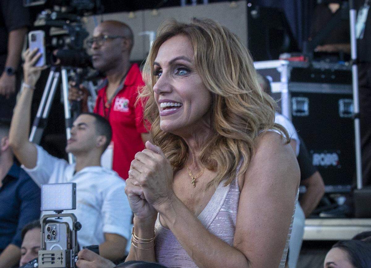 Lili Estefan, mother of Lina Luaces cheers for her daughter during the Miss Universe Cuba 2025 pageant, on Tuesday, July 8, 2025, in Hialeah, Fla.