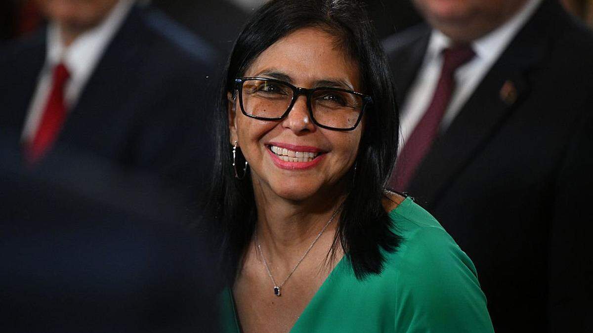 TOPSHOT - Venezuela's interim President Delcy Rodriguez smiles after a session of the National Assembly in Caracas on January 5, 2026. Venezuela's new parliament opened on January 5 with lawmakers chanting "Let's go Nico!" as they forcibly denounced the recent capture of leftist leader Nicolas Maduro in a US military operation on January 3. (Photo by Federico PARRA / AFP via Getty Images)